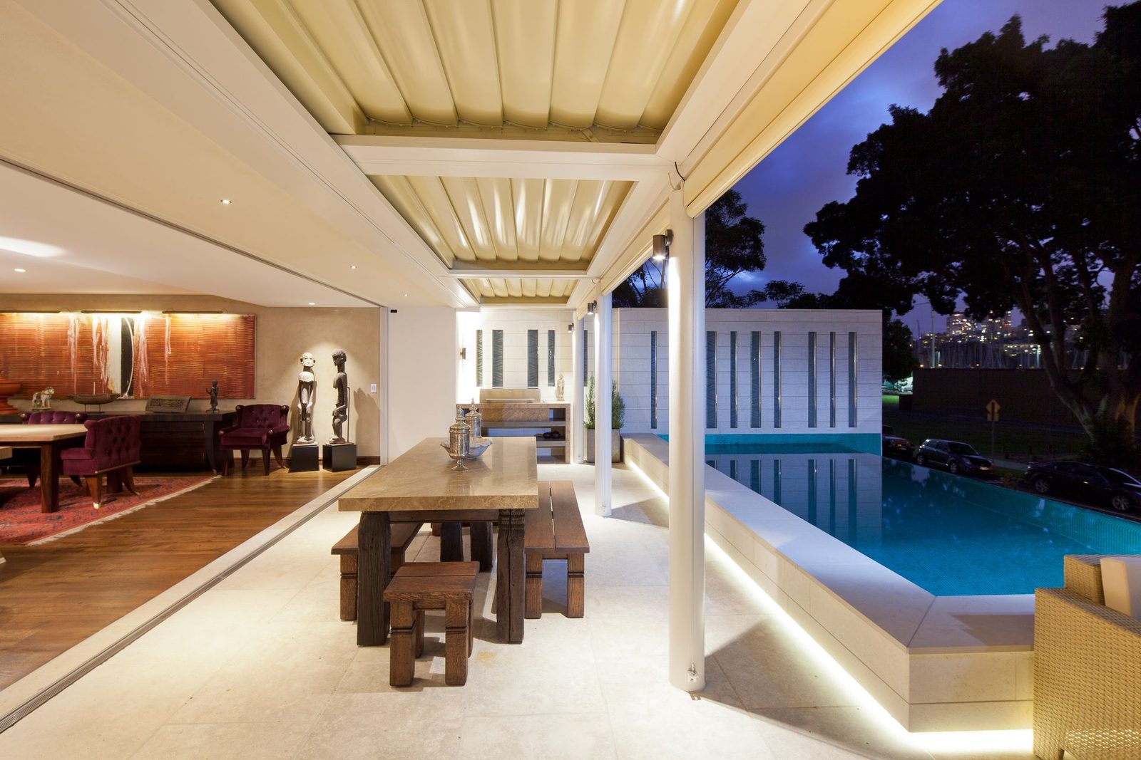 Covered patio beside a pool — design inspiration