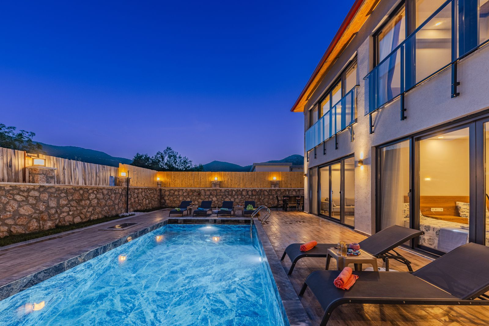 Long pool lit in the evening — design inspiration (stock photo)